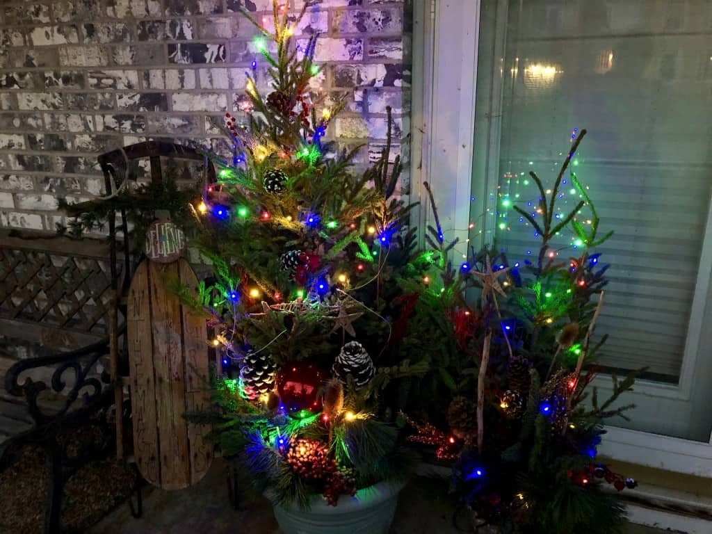 decorated pots on porch at night